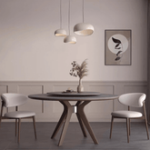 Grey round sintered stone dining table with rotating lazy Susan and simplistic design